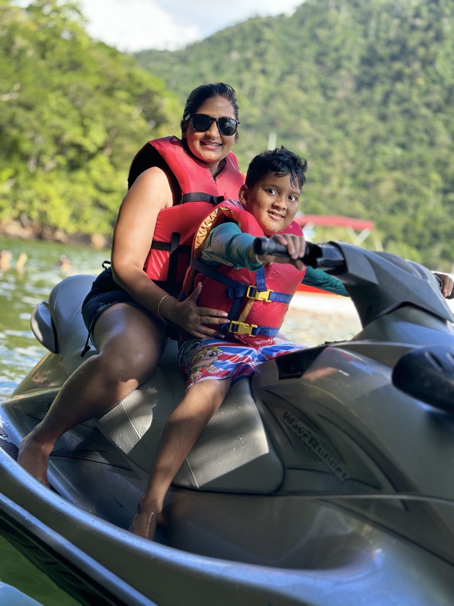 Mother and son on jet ski